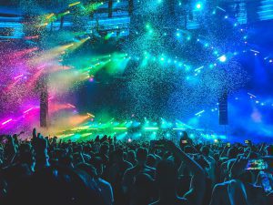 rainbow colored light show at concert