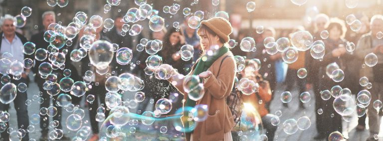Asian woman surrounded by bubbles