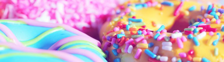 Bright, multicolored donuts with sprinkles