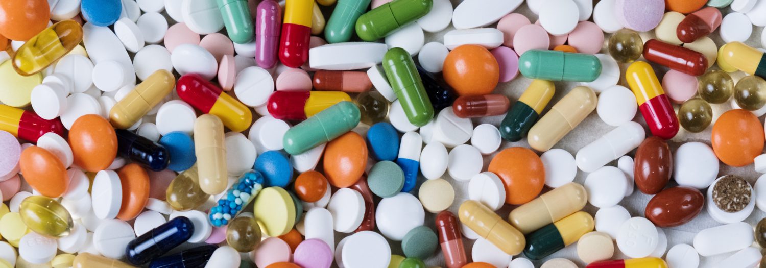 Multicolored piles of medicinal pills and vitamins