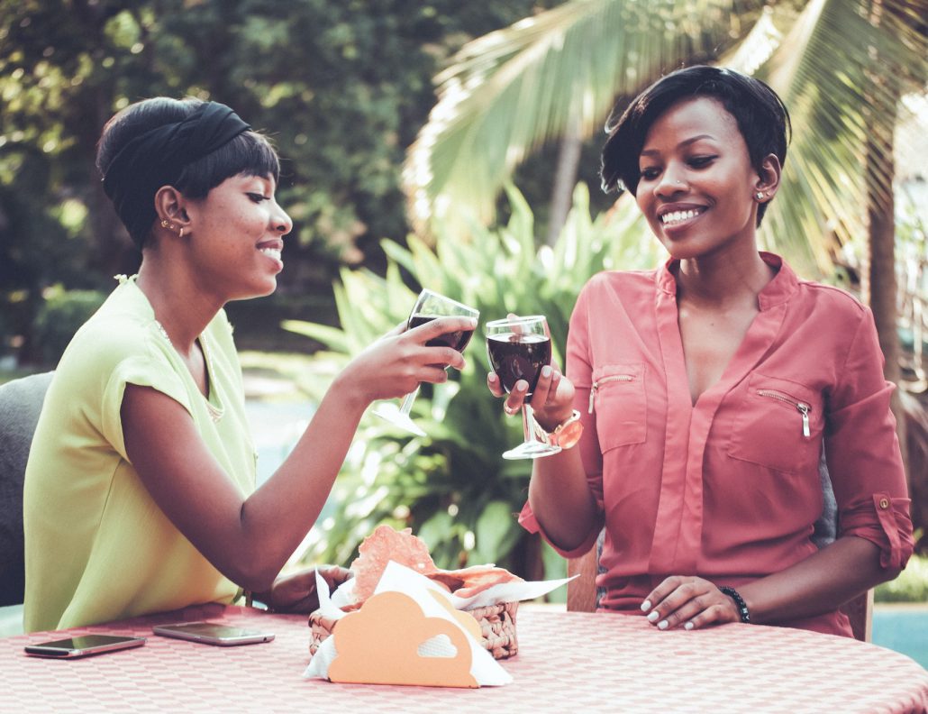 Two Black Women drinking wine