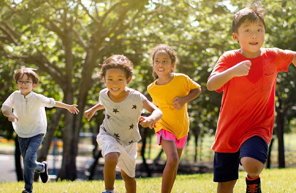 multicultural children running and playing outside