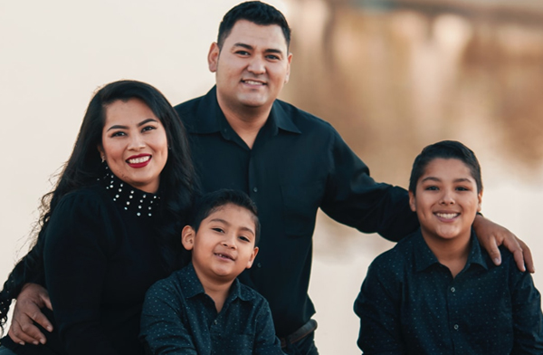 Hispanic parents and children posing for photo