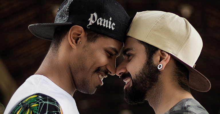 gay black male couple smiling at each other