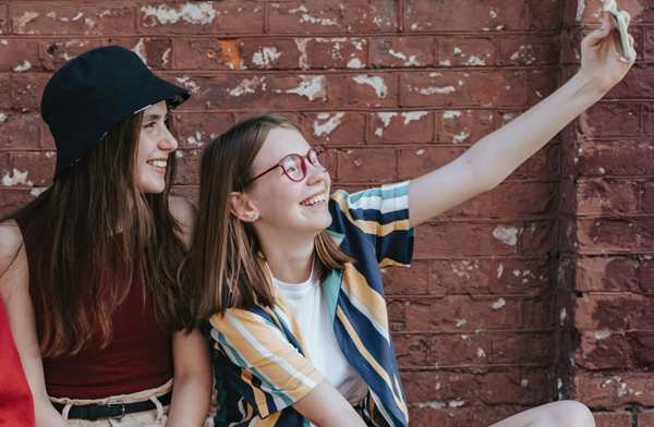 young American teenage girls taking a selfie