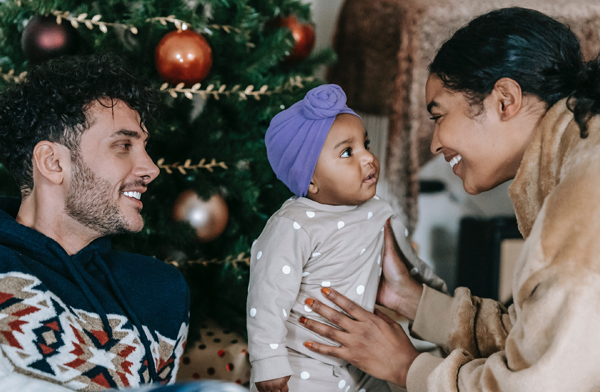 multicultural parents and child celebrating winter holidays