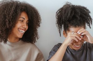 Two black Gen Z women laughing