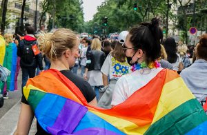 Two women marching in gay pride parade