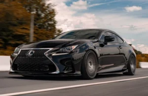 A Lexus sedan driving on the street