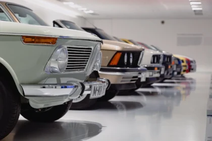 A lineup of classic luxury cars parked