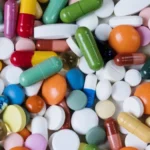 Pile of different colors and styles and sized of pills