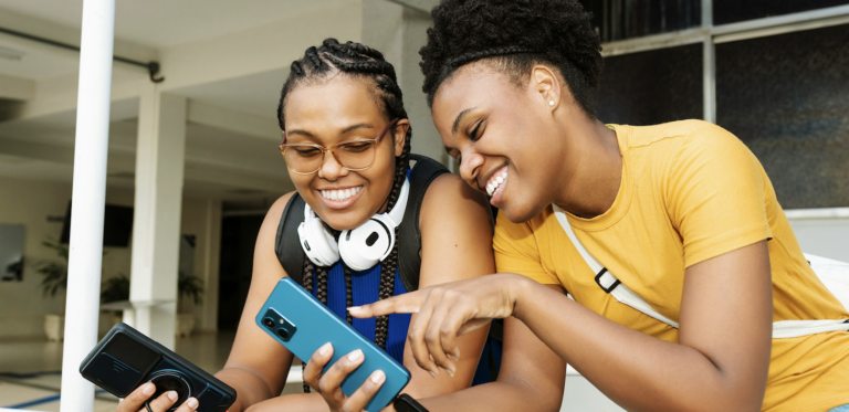 Two women looking at their phones