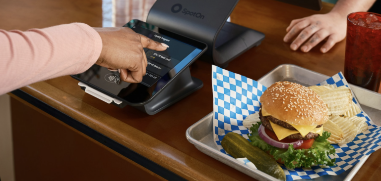 Woman ordering food at a QSR restaurant