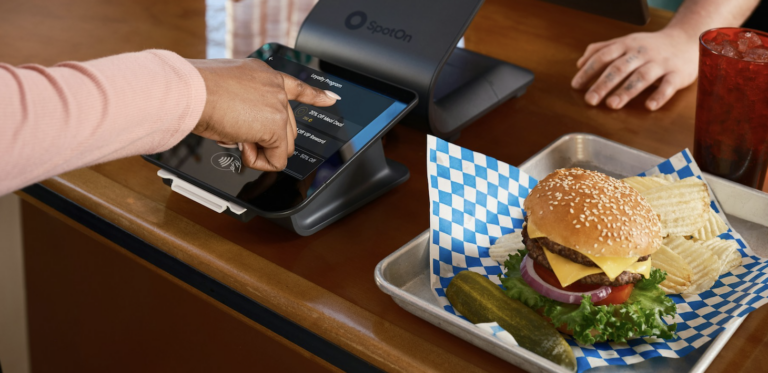 Woman ordering food at a QSR restaurant